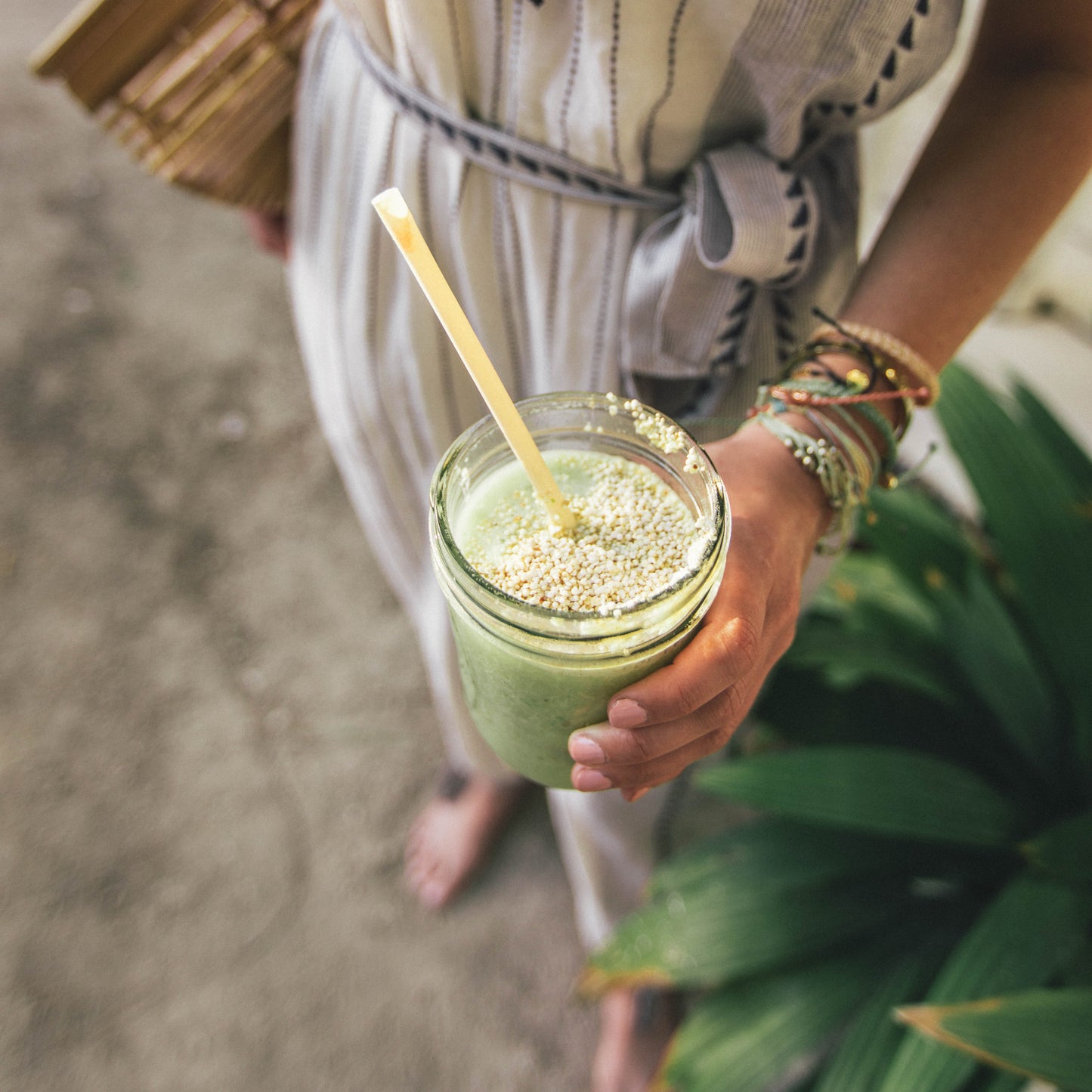 Woman holding a smoothie in a glass